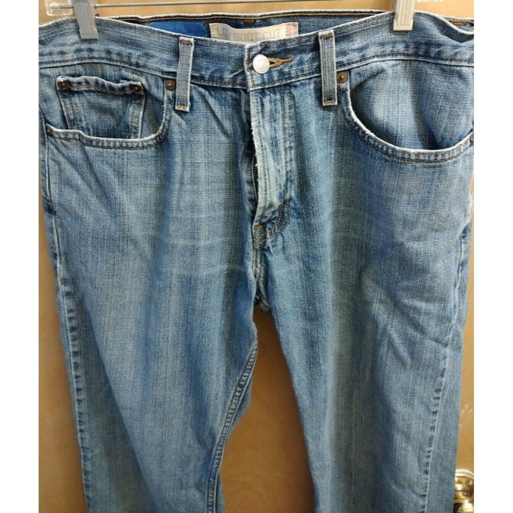 SOLD!!!    preowned Vintage Levis 527 low boot cut 32x34 stonewashed distressed